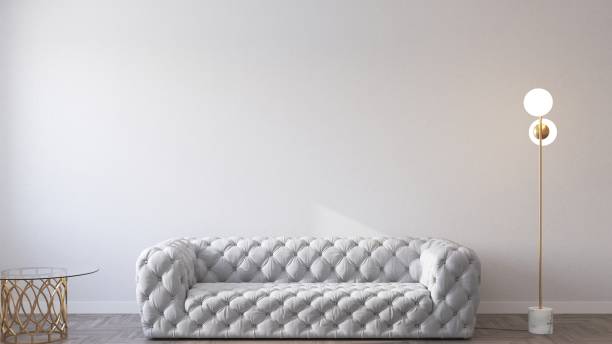 Modern sofa on empty wall background