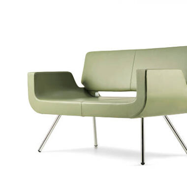 Side view of green leather sofa isolated on white background