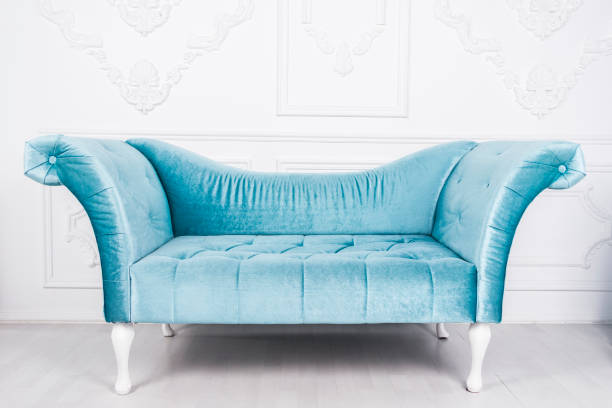 Blue sofa in white interior and gray floor. venetian style